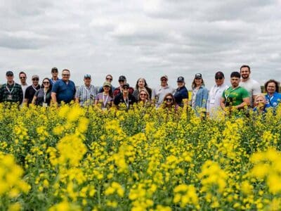 NathanJones-farm-tour-2026-posed-group-shot-in-canola-field